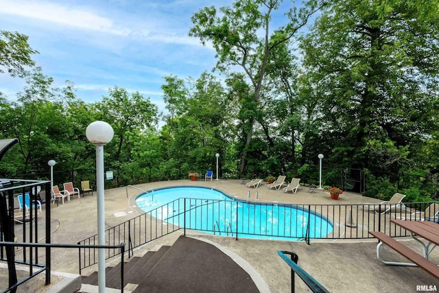 1800 7th St Unit 10E, East Moline, IL 61244 - community pool featuring a patio area and view of scattered trees