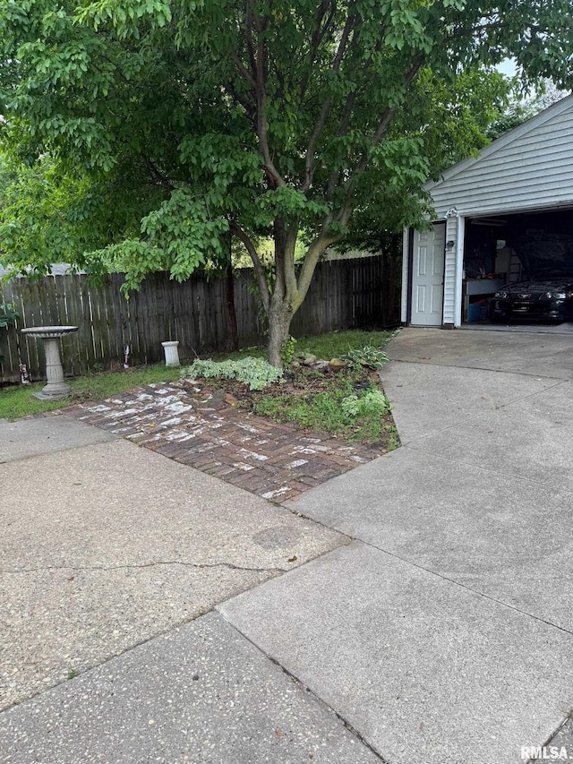235 20th Pl, Clinton, IA 52732 - view of home's exterior featuring concrete driveway and a garage