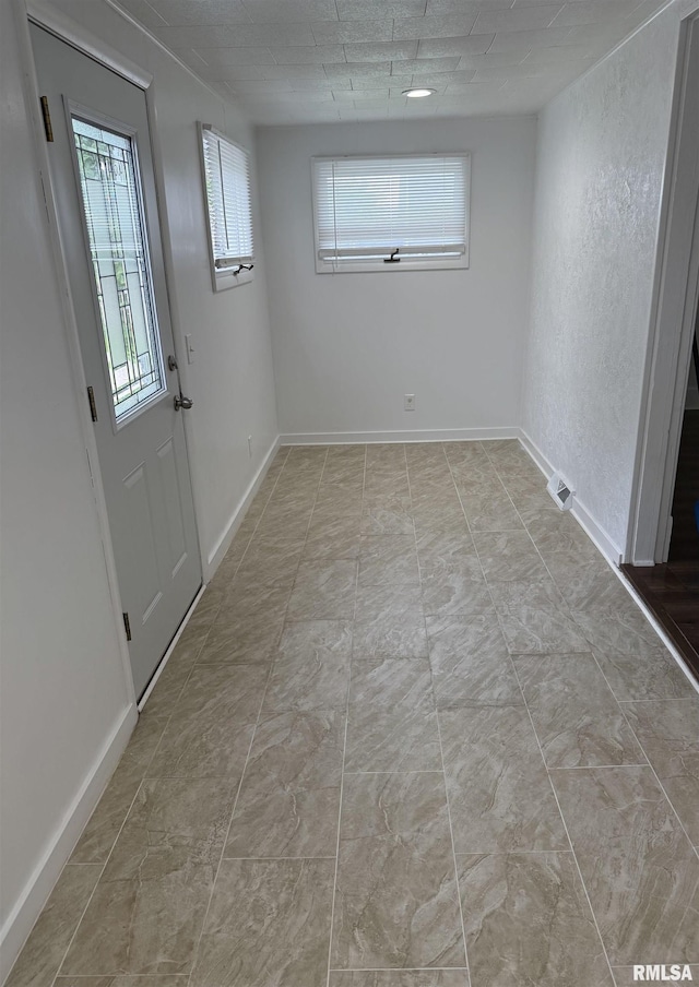 235 20th Pl, Clinton, IA 52732 - spare room with baseboards