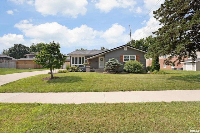 1217 7th St, De Witt, IA 52742 - view of front of property with driveway and a metal roof