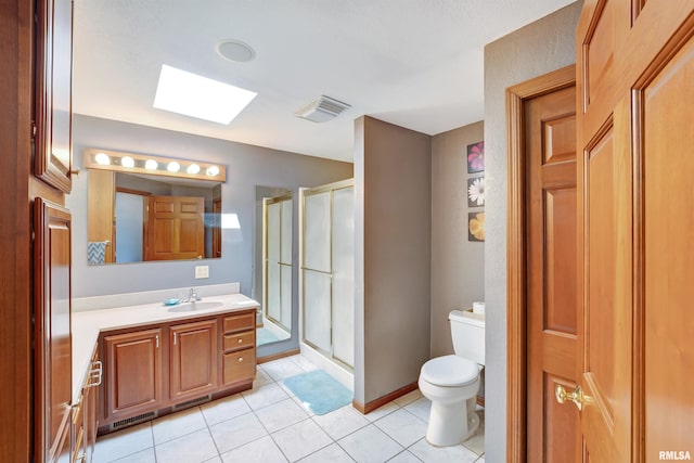 1217 7th St, De Witt, IA 52742 - full bathroom with a skylight, vanity, a stall shower, and tile patterned floors