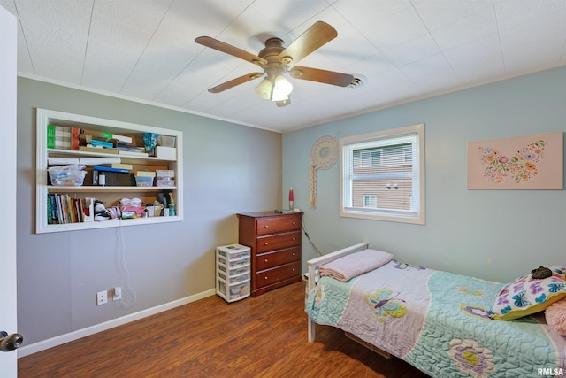 1217 7th St, De Witt, IA 52742 - bedroom with wood finished floors, ornamental molding, and ceiling fan