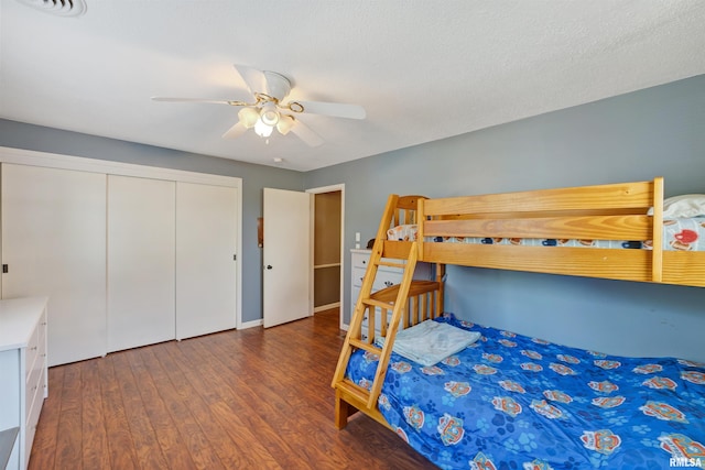 1217 7th St, De Witt, IA 52742 - bedroom with wood finished floors, a closet, and ceiling fan