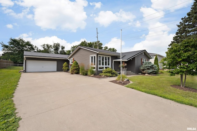 1217 7th St, De Witt, IA 52742 - single story home with driveway, a metal roof, and a garage