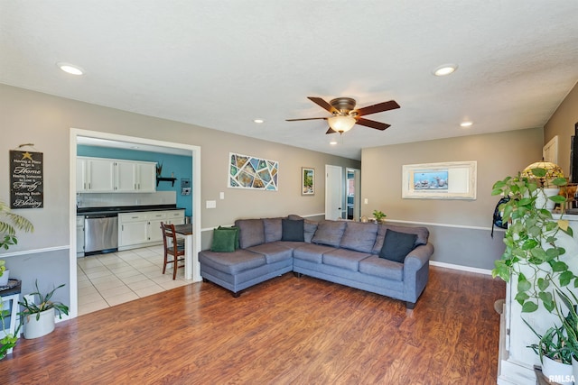 1217 7th St, De Witt, IA 52742 - living room with ceiling fan, recessed lighting, and light wood-type flooring