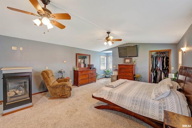 1217 7th St, De Witt, IA 52742 - carpeted bedroom with vaulted ceiling, a closet, a ceiling fan, and a walk in closet