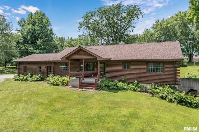 4830 Wyoming Ave, Davenport, IA 52806 - cabin featuring log exterior, a front lawn, and a porch