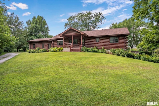 4830 Wyoming Ave, Davenport, IA 52806 - log home with log siding, covered porch, and a front lawn