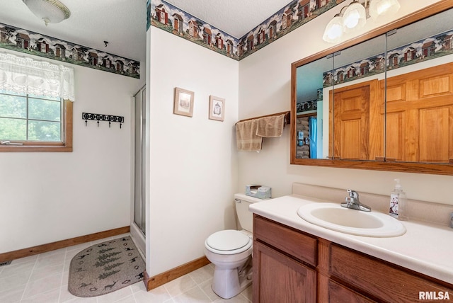 4830 Wyoming Ave, Davenport, IA 52806 - bathroom featuring vanity, a shower with door, tile patterned flooring, and a textured ceiling