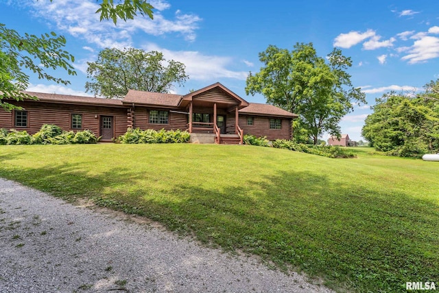 4830 Wyoming Ave, Davenport, IA 52806 - cabin with log exterior, covered porch, and a front lawn