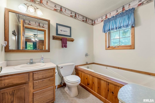 4830 Wyoming Ave, Davenport, IA 52806 - full bathroom with a garden tub, vanity, and a textured ceiling