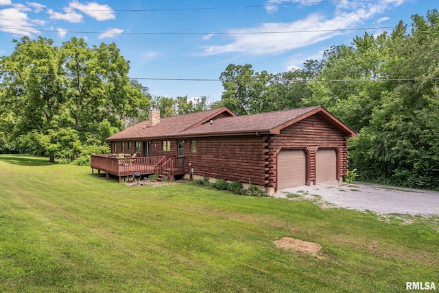 4830 Wyoming Ave, Davenport, IA 52806 - log cabin featuring log exterior, a deck, a front yard, a chimney, and a detached garage