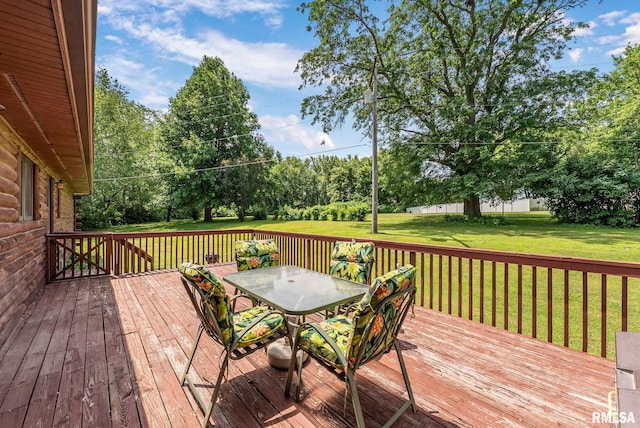 4830 Wyoming Ave, Davenport, IA 52806 - wooden deck with outdoor dining space and a yard