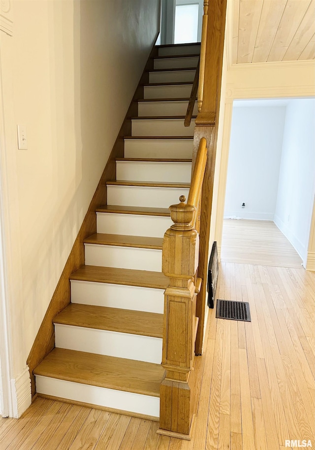 616 Elk St, Sabula, IA 52070 - stairway featuring hardwood / wood-style flooring and baseboards