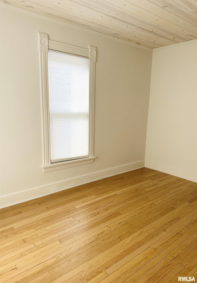 616 Elk St, Sabula, IA 52070 - spare room featuring ornamental molding, light wood-style floors, and wooden ceiling