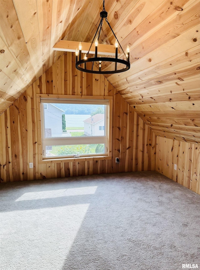 616 Elk St, Sabula, IA 52070 - bonus room with a chandelier, vaulted ceiling, wooden walls, wood ceiling, and carpet flooring