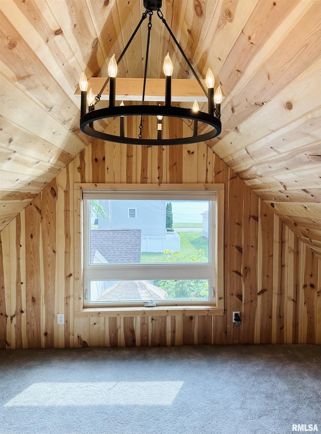 616 Elk St, Sabula, IA 52070 - bonus room featuring lofted ceiling, wood walls, carpet flooring, wood ceiling, and a chandelier