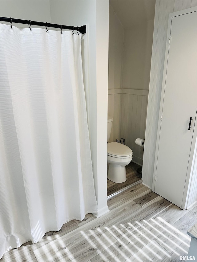 616 Elk St, Sabula, IA 52070 - bathroom with wood finished floors and wainscoting
