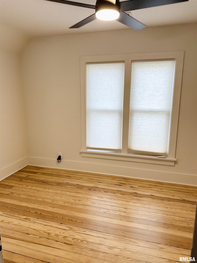 616 Elk St, Sabula, IA 52070 - empty room featuring ceiling fan, light wood finished floors, plenty of natural light, and lofted ceiling