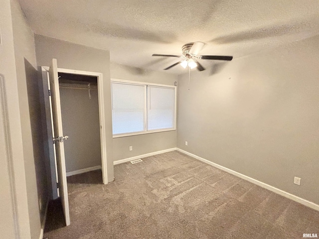 616 1st Ave, Silvis, IL 61282 - unfurnished bedroom featuring a textured ceiling, carpet flooring, ceiling fan, and a closet