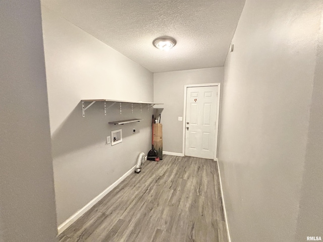 616 1st Ave, Silvis, IL 61282 - washroom featuring hookup for a gas dryer, washer hookup, wood finished floors, a textured ceiling, and electric dryer hookup