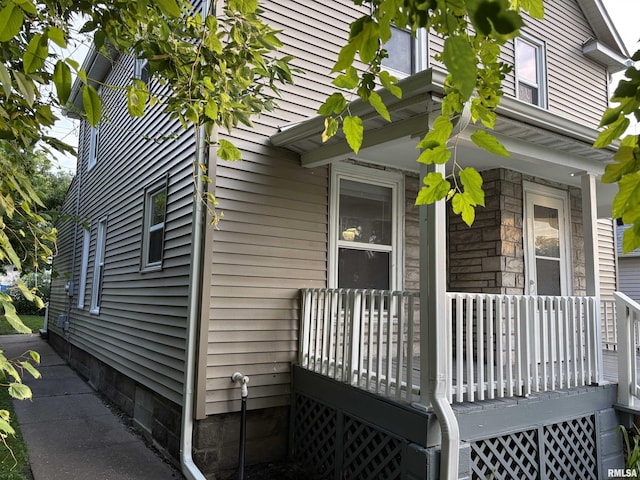 616 1st Ave, Silvis, IL 61282 - view of home's exterior featuring stone siding and a porch