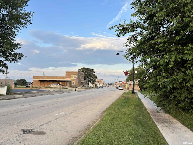 616 1st Ave, Silvis, IL 61282 - view of asphalt road with street lighting, sidewalks, and curbs
