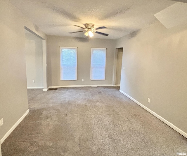 616 1st Ave, Silvis, IL 61282 - unfurnished room featuring a ceiling fan, a textured ceiling, and carpet flooring