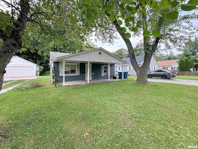 3327 2nd St, East Moline, IL 61244 - bungalow-style home featuring covered porch, a front lawn, and a detached garage