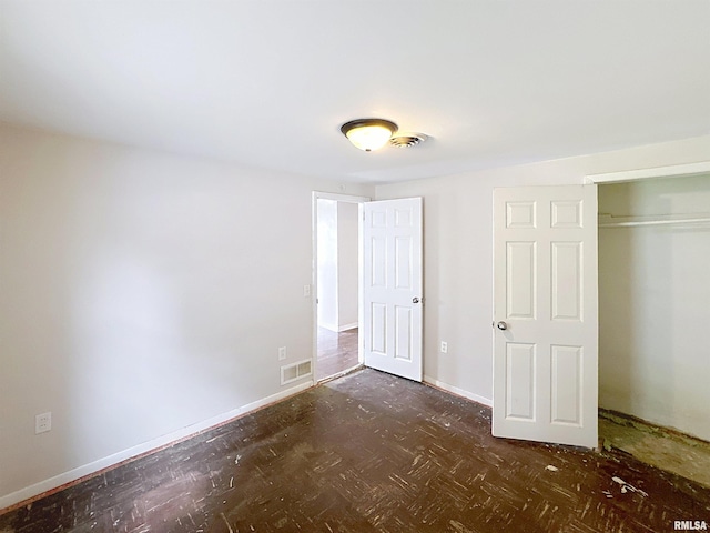 3327 2nd St, East Moline, IL 61244 - unfurnished bedroom with baseboards and a closet