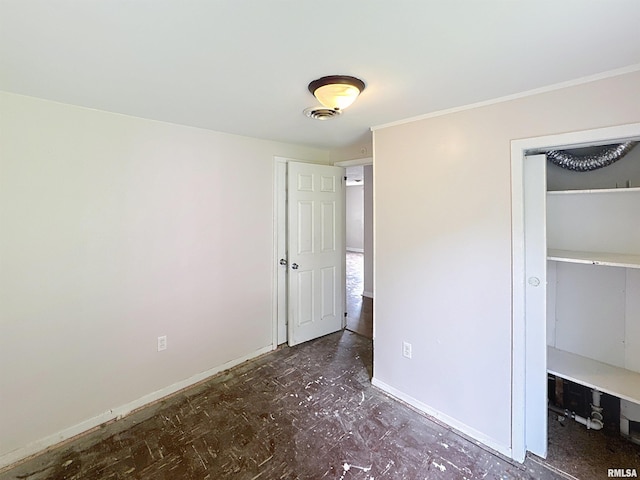 3327 2nd St, East Moline, IL 61244 - unfurnished bedroom with baseboards and ornamental molding
