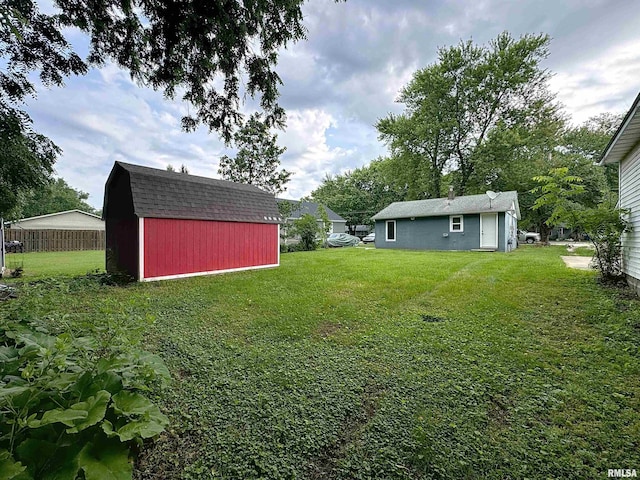 3327 2nd St, East Moline, IL 61244 - view of grassy yard with a storage shed