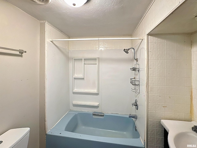 3327 2nd St, East Moline, IL 61244 - full bathroom featuring bathing tub / shower combination and a textured ceiling