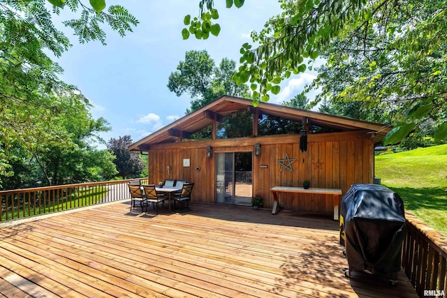 28002 230th St, Le Claire, IA 52753 - deck with outdoor dining area and a lawn