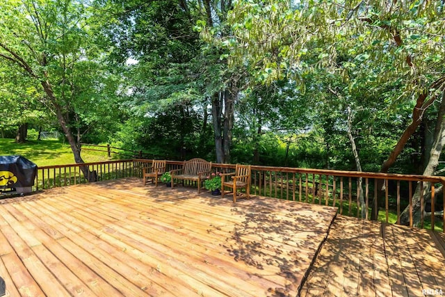 28002 230th St, Le Claire, IA 52753 - wooden terrace featuring a grill, view of scattered trees, and a lawn