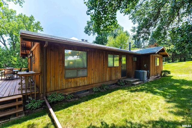 28002 230th St, Le Claire, IA 52753 - back of property with a deck and a yard