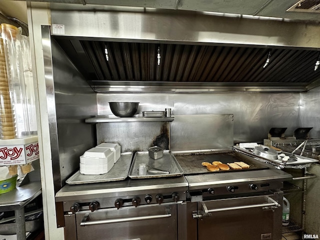 1204 N Cody Rd, Le Claire, IA 52753 - kitchen featuring dark brown cabinets