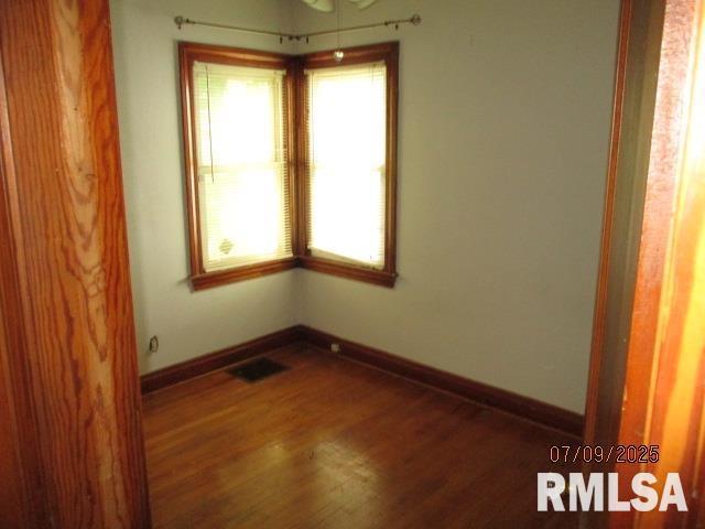 507 Waverly Rd, Davenport, IA 52804 - unfurnished room with wood finished floors and baseboards