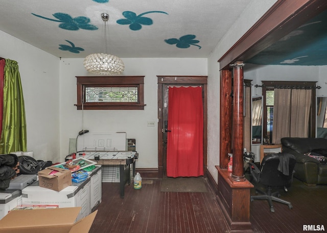 1610 12th Ave, Rock Island, IL 61201 - home office featuring wood-type flooring, a chandelier, and a textured ceiling