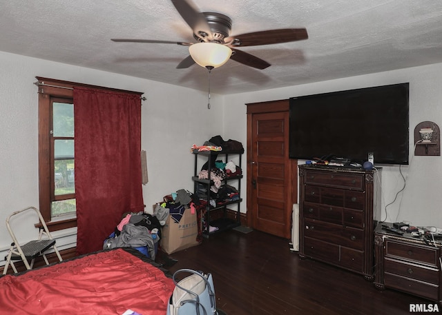 1610 12th Ave, Rock Island, IL 61201 - bedroom with dark wood-type flooring, a textured ceiling, and a ceiling fan