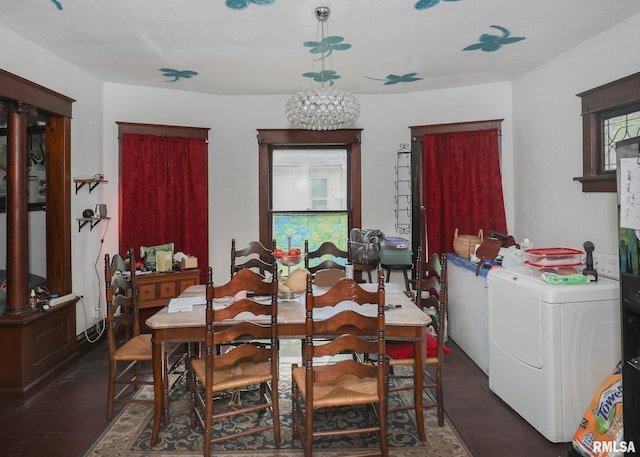 1610 12th Ave, Rock Island, IL 61201 - dining space with separate washer and dryer, wood finished floors, and a chandelier