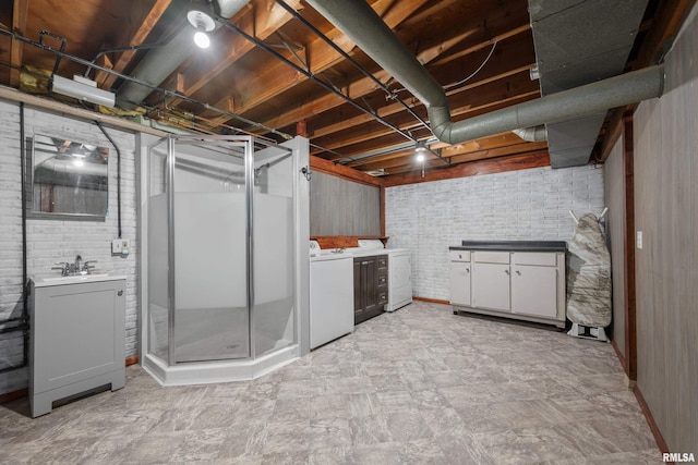 101 W Sheridan Dr, Eldridge, IA 52748 - unfinished basement with washer and dryer and brick wall
