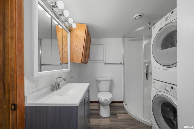 101 W Sheridan Dr, Eldridge, IA 52748 - bathroom featuring stacked washer / drying machine, vanity, a shower stall, and wood finished floors