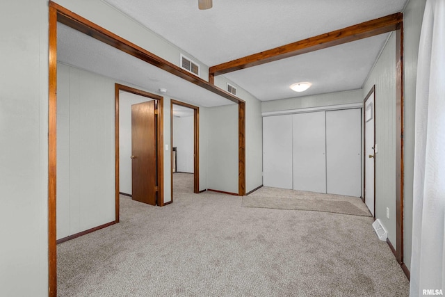101 W Sheridan Dr, Eldridge, IA 52748 - unfurnished bedroom featuring carpet, a closet, and a ceiling fan