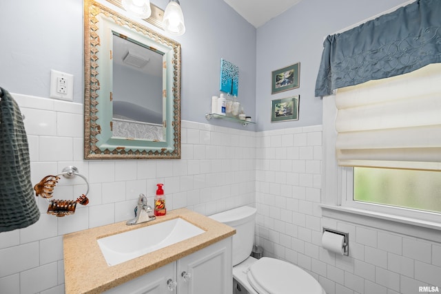 3110 Jefferson Ave, Davenport, IA 52803 - half bath featuring tile walls, vanity, and a wainscoted wall