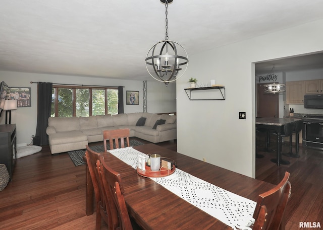 4512 11th Ave Unit C, Moline, IL 61265 - dining space with a chandelier and dark wood finished floors