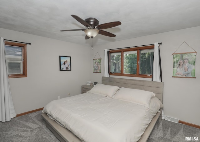 4512 11th Ave Unit C, Moline, IL 61265 - carpeted bedroom featuring baseboards and a ceiling fan