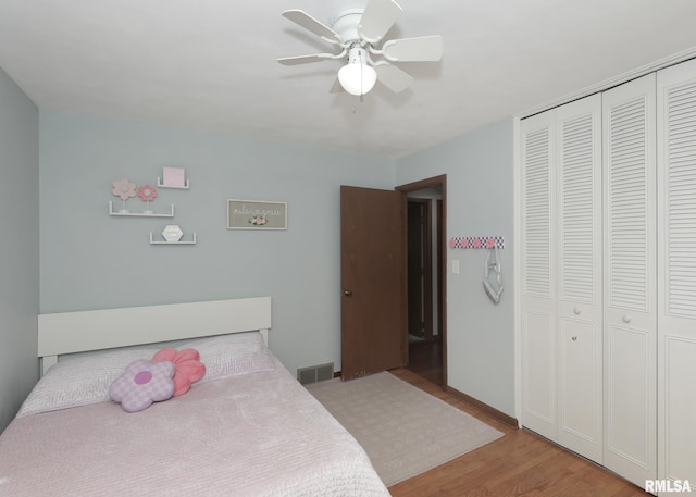 4512 11th Ave Unit C, Moline, IL 61265 - bedroom featuring light wood-style flooring, a closet, and a ceiling fan