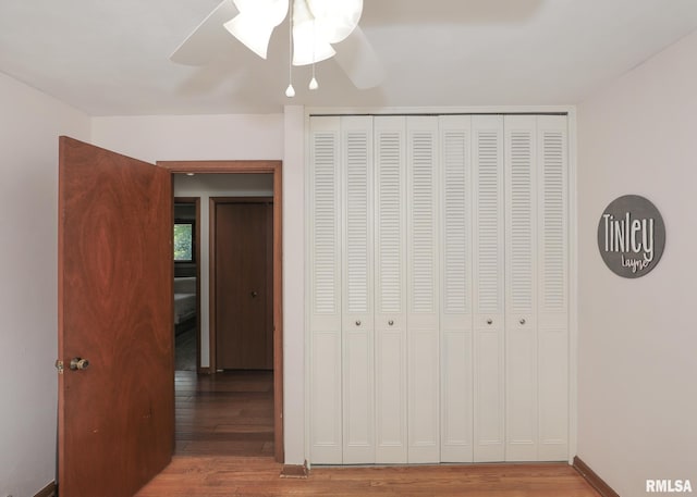 4512 11th Ave Unit C, Moline, IL 61265 - unfurnished bedroom featuring wood finished floors, a closet, and a ceiling fan
