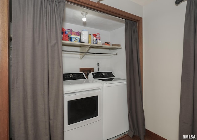 4512 11th Ave Unit C, Moline, IL 61265 - washroom with washing machine and dryer and dark wood-style floors